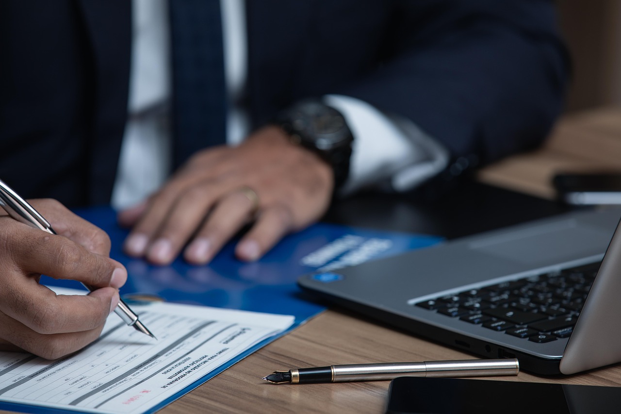 Official signing of a financial document with a fountain pen