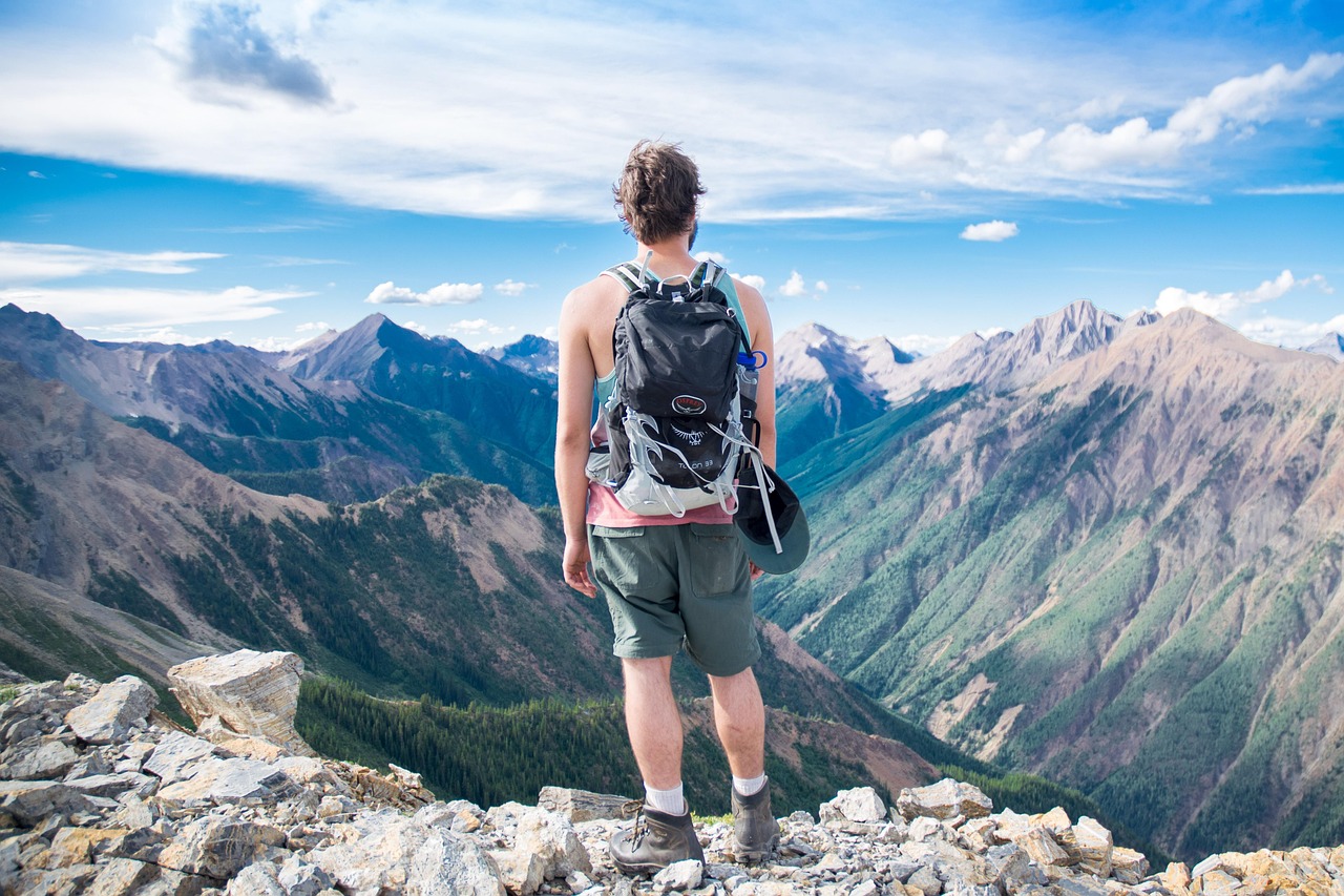 A person relaxing on a balcony with a scenic mountain view