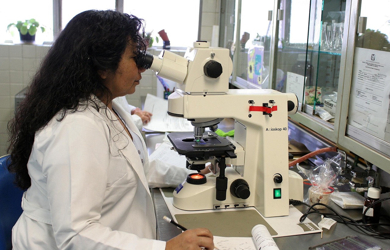 A dental student practicing restorative techniques in a professional medical lab.